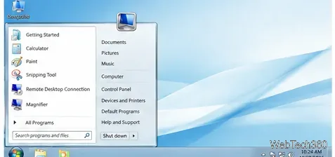Un escritorio minimalista al estilo de Windows 7 con fondo de pantalla abstracto blanco y azul y menú de inicio pálido.