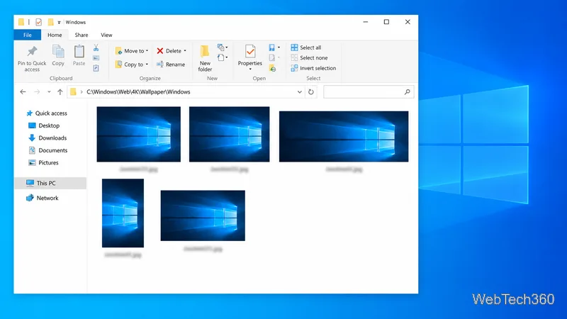 Several landscape and portrait versions of the blue Windows 10 Hero background in File Explorer