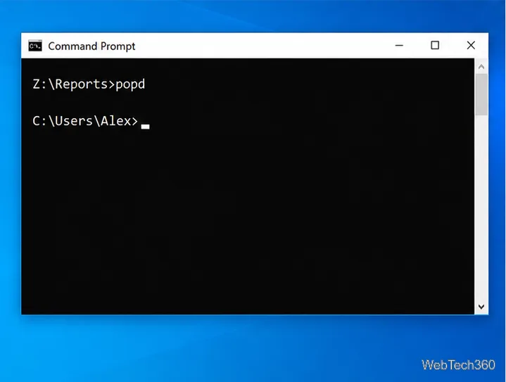 Command Prompt showing popd returning from Z colon backslash Reports to C colon backslash Users backslash Alex