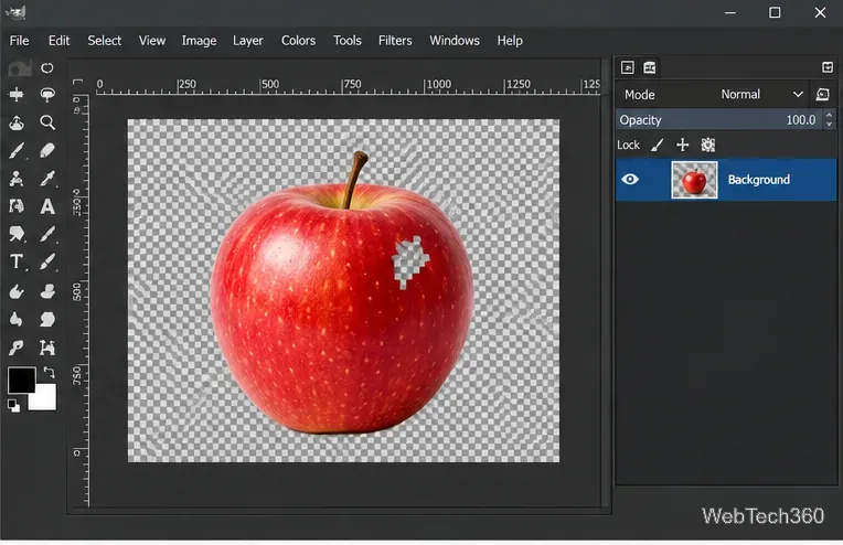 Tela do GIMP mostrando um pequeno recorte quadriculado dentro de uma maçã vermelha após ser apagado.