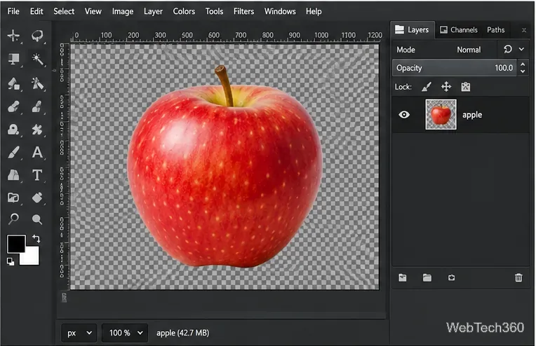 Uma maçã vermelha na tela quadriculada do GIMP após a remoção do fundo branco selecionado.