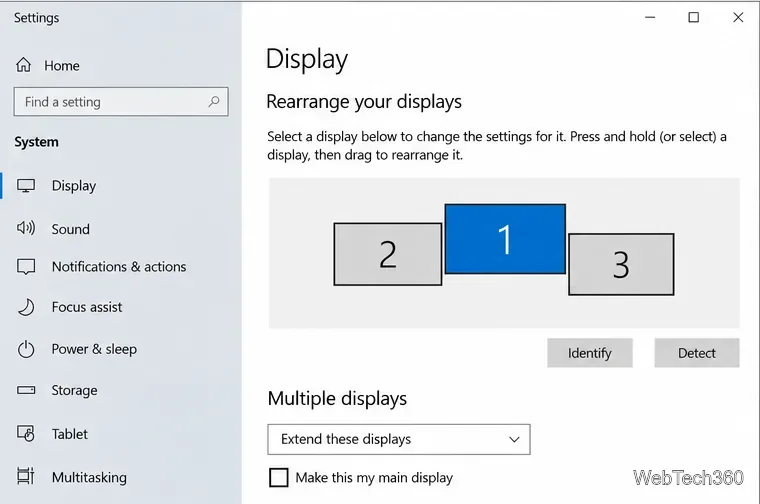 Windows 10 Display settings showing three monitors arranged with different vertical positions