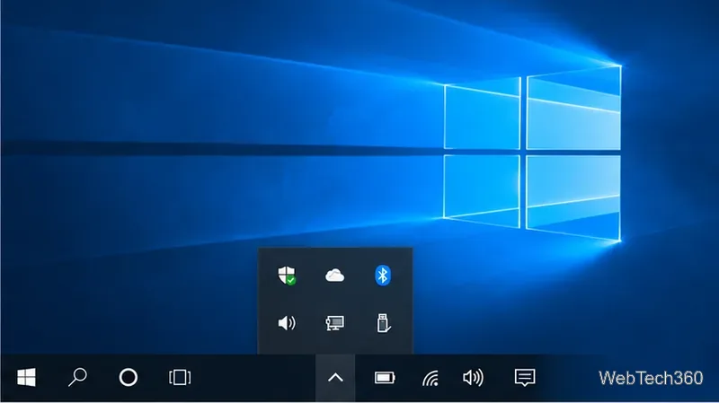 แถบงานของ Windows 10 พร้อมแผงไอคอนแจ้งเตือนที่ซ่อนอยู่ซึ่งขยายอยู่ด้านบน