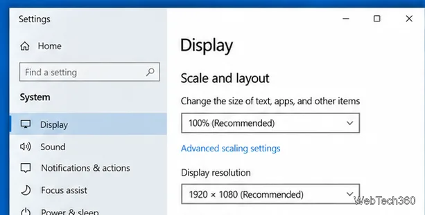 Windows 10 System Display settings showing Scale and layout, the text and apps size option at 100 percent recommended, and the recommended display resolution.