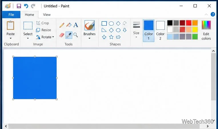 Um quadrado azul colado em uma tela em branco no clássico Paint do Windows.