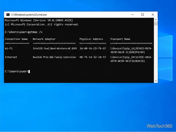 O prompt de comando exibe a saída do comando getmac /v com os nomes e endereços físicos dos adaptadores Wi-Fi e Ethernet.
