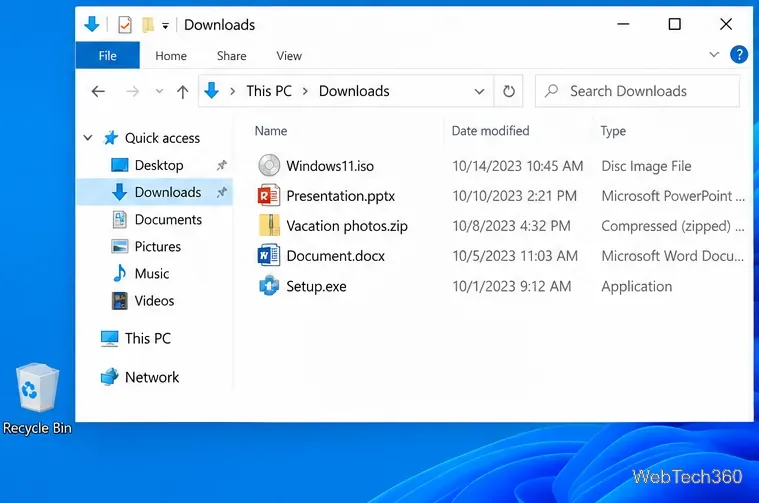 Un dossier Téléchargements contenant une image ISO, une archive ZIP et d'autres fichiers, avec la Corbeille visible sur le bureau.