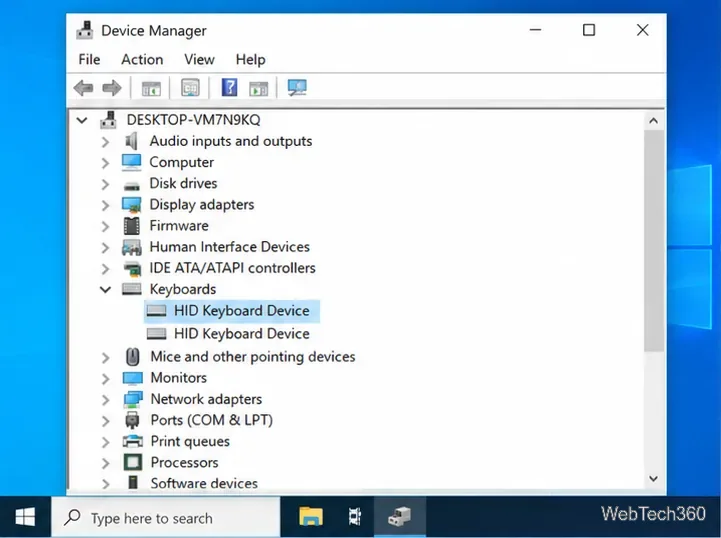 Windows 10 Device Manager with the Keyboards category expanded and HID Keyboard Device selected