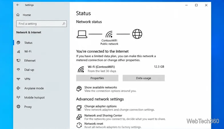 Windows 10 Network & Internet Status page with the Network reset link visible near the bottom.