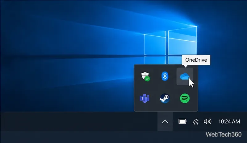 Windows 10 hidden notification icons expanded above the taskbar, with a OneDrive tooltip.