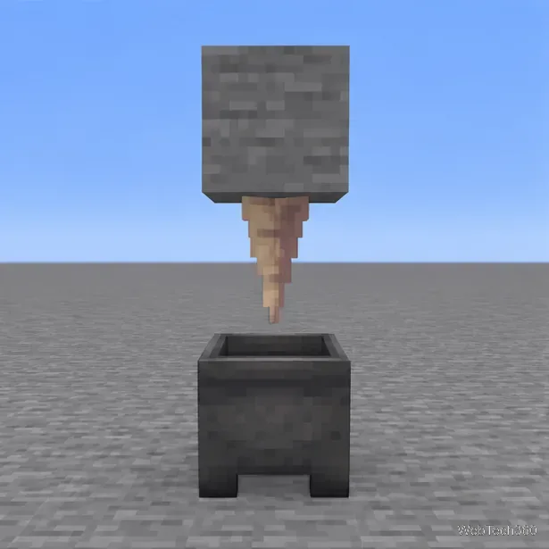 A downward-pointing dripstone hanging from a solid block above an empty cauldron