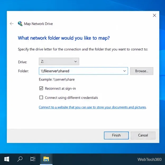 The Map Network Drive dialog showing a drive letter, an example UNC path, and the Reconnect at sign-in option.