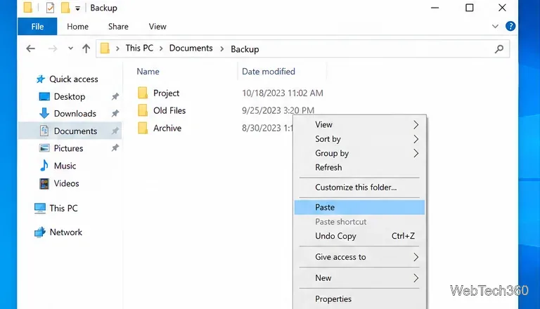 Windows 10 File Explorer in the Backup folder with the Paste command selected