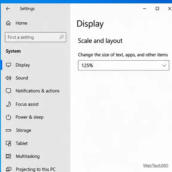 Ustawienia wyświetlania systemu Windows 10 pokazujące skalę i układ oraz kontrolkę rozmiaru tekstu, aplikacji i innych elementów