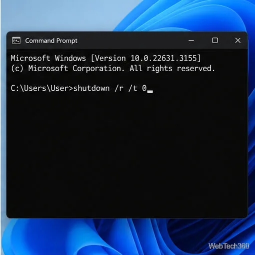 Uma janela do Prompt de Comando contém o comando shutdown /r /t 0.