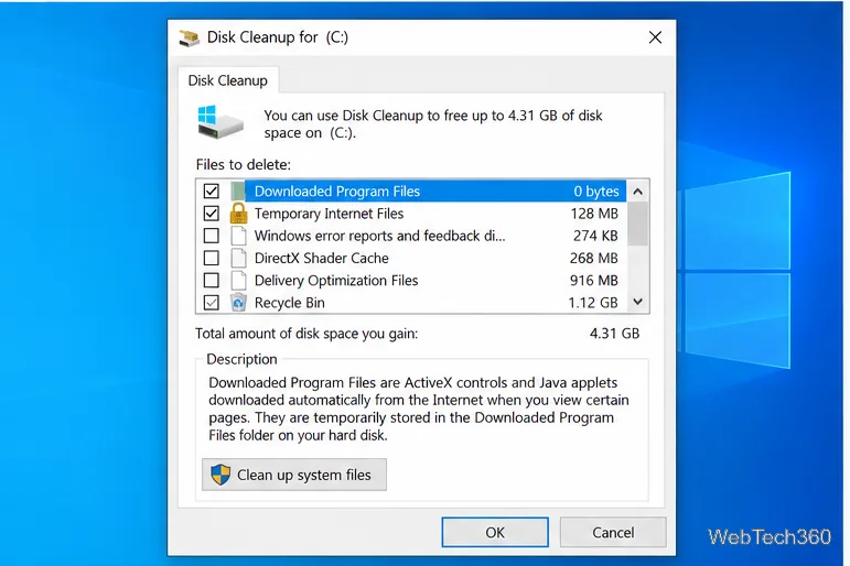 The Disk Cleanup dialog lists file categories, their space estimates, and a Clean up system files button.