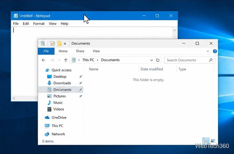 Desktopul Windows 10 cu Notepad și File Explorer deschise și indicatorul plasat deasupra unei ferestre
