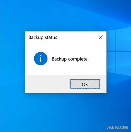 A Windows information dialog titled Backup status with the message Backup complete and an OK button.