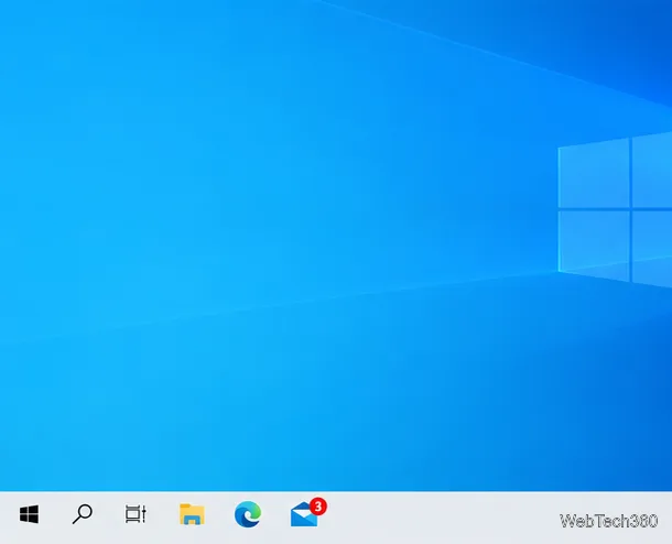 Pasek zadań systemu Windows 10 z małym symbolem liczby na ikonie aplikacji Poczta.