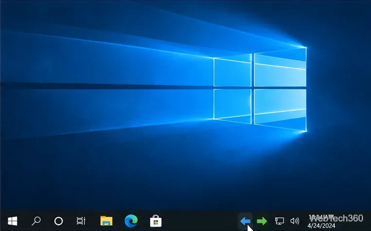 Zone de notification de la barre des tâches de Windows 10 avec les flèches gauche et droite de VirtualDesktopSwitcher visibles.
