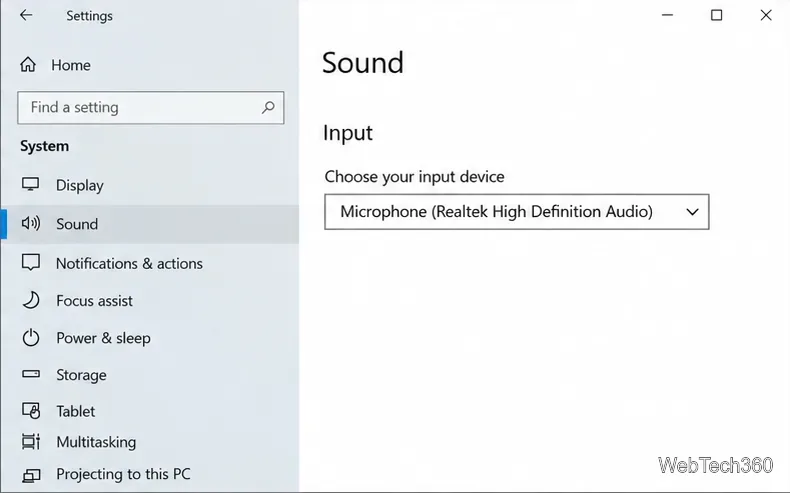 Windows 10 Sound settings showing a Realtek microphone selected under Input.