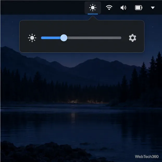 Menú emergente de atenuación de la bandeja del sistema Linux con un control deslizante y un icono de configuración sobre un escritorio oscuro.
