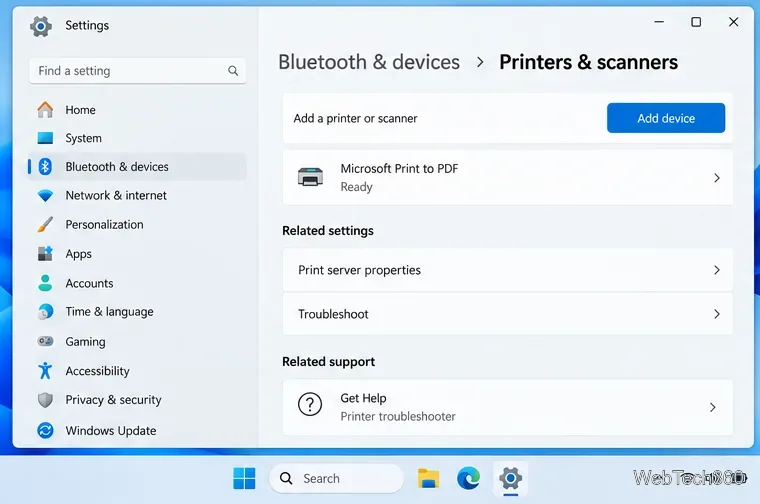 Page d'exemple des paramètres Imprimantes et scanners de Windows 11 montrant une imprimante installée marquée comme prête et un lien vers l'outil de dépannage de l'imprimante.