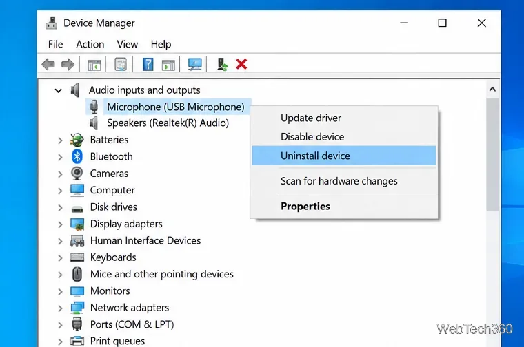 Windows 10 Device Manager showing a USB microphone with update and uninstall device options