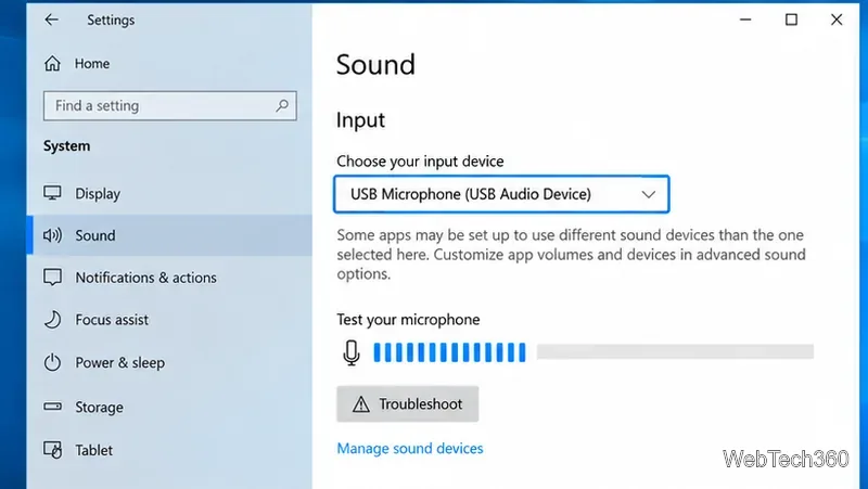 Windows 10 Sound settings with USB Microphone selected under Input and the test meter moving